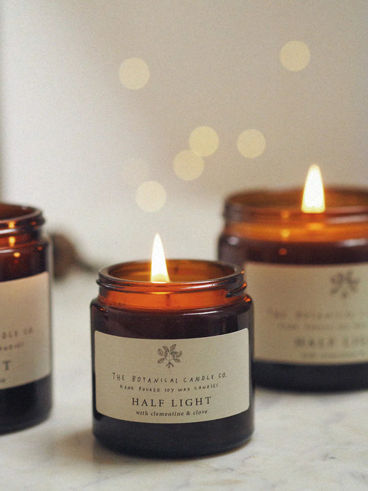 Half Light Clementine & Clove Scented Candle in Amber Jar